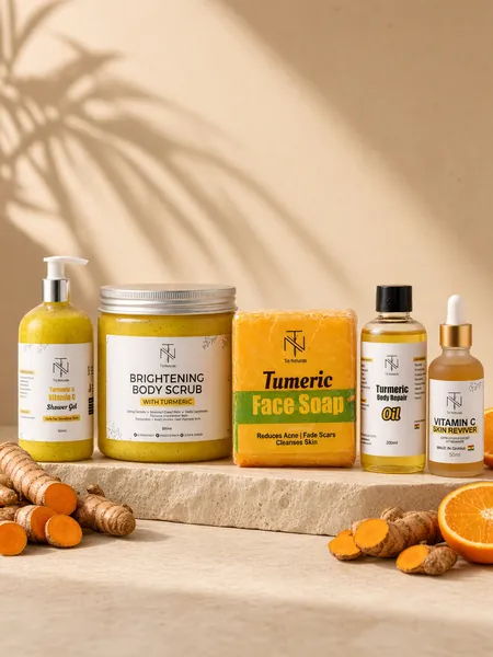 The turmeric range on stone with fresh turmeric roots and a halved orange